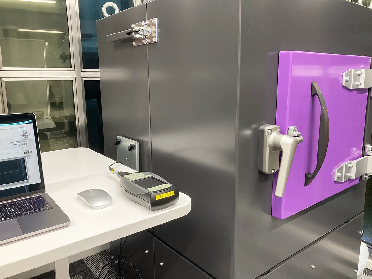 Closed Door Anechoic Test Box attached with handheld analyzer Closed Door Anechoic Test Box attached with handheld analyzer